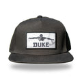 Black flat-brim snapback with woven black and white photo patch of Duke Kahanamoku swimming