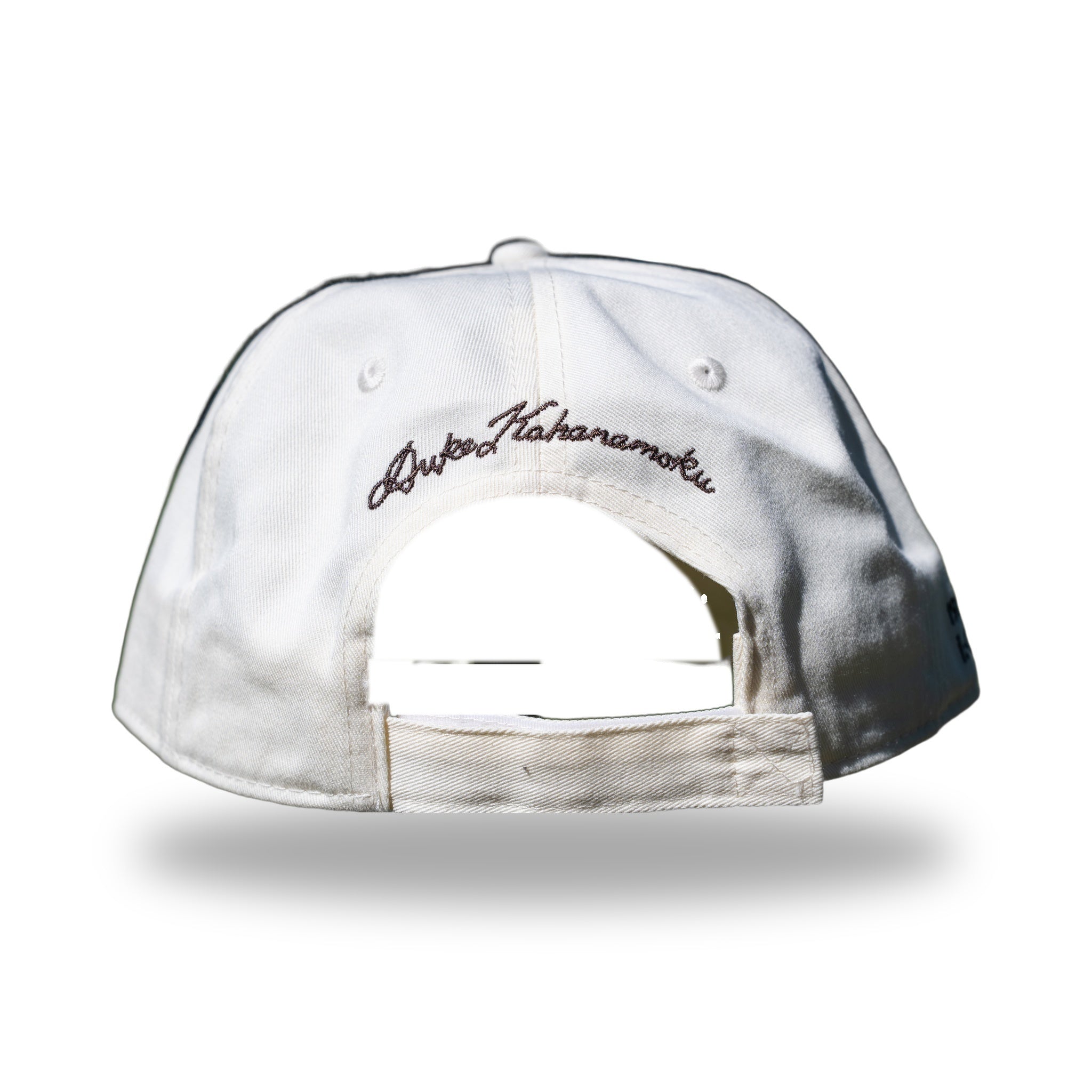 Back of cream DUKE cap with Duke Kahanamoku signature embroidery above strapback closure