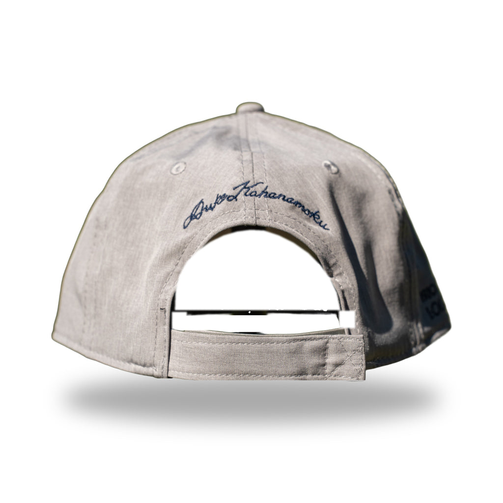 Back of heather gray DUKE cap with navy Duke Kahanamoku signature embroidery above strapback closure