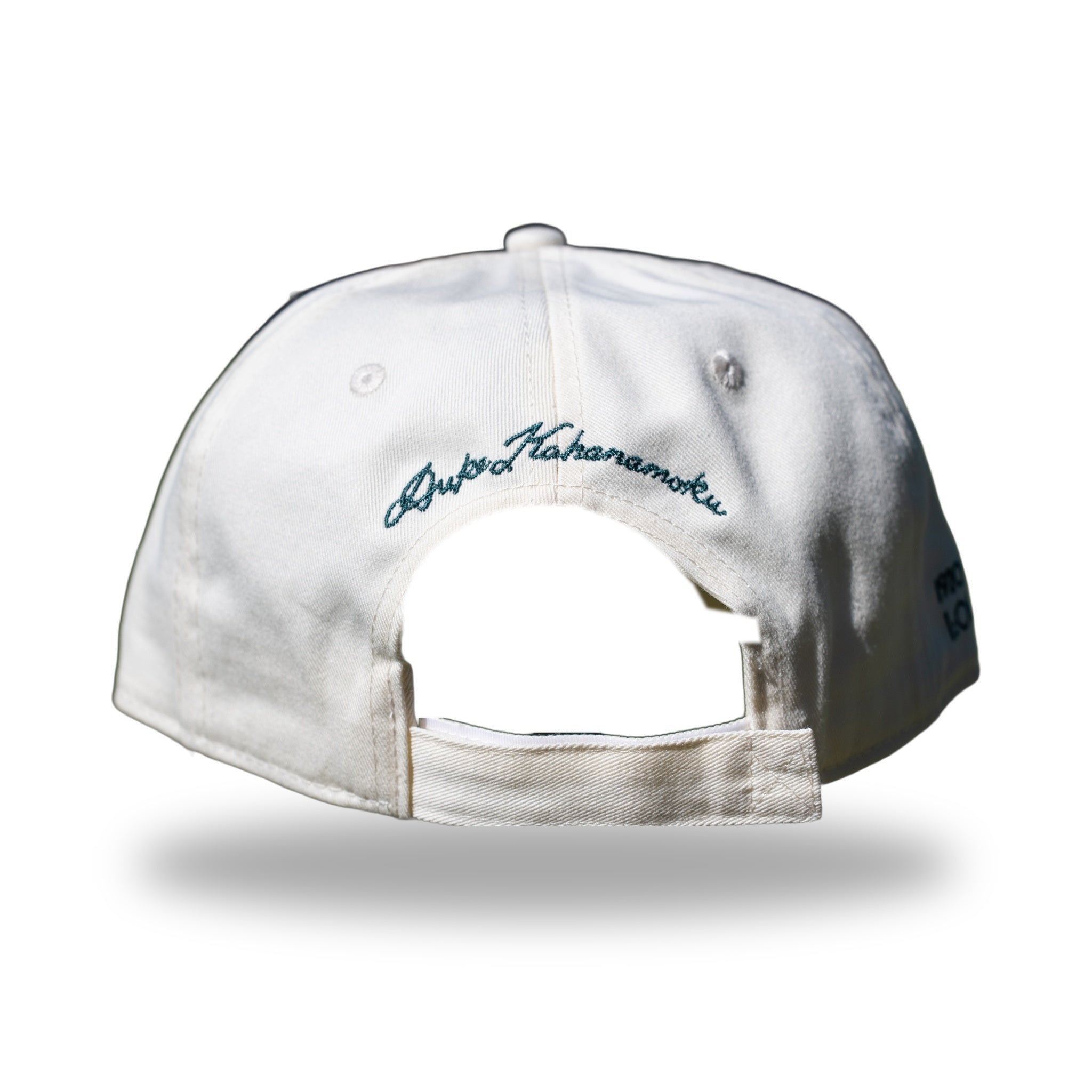 Back of ivory DUKE cap with Duke Kahanamoku signature embroidery above strapback closure