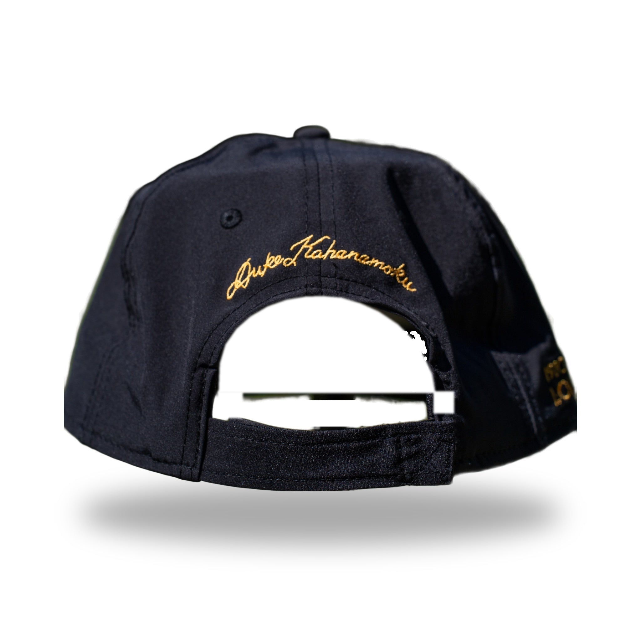 Back of navy DUKE cap with gold Duke Kahanamoku signature embroidery above strapback closure