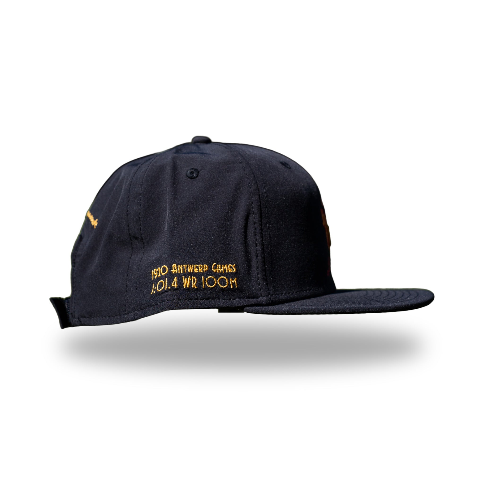 Side of navy DUKE cap showing 1920 Antwerp Games 1:01.4 WR 100M embroidery in gold