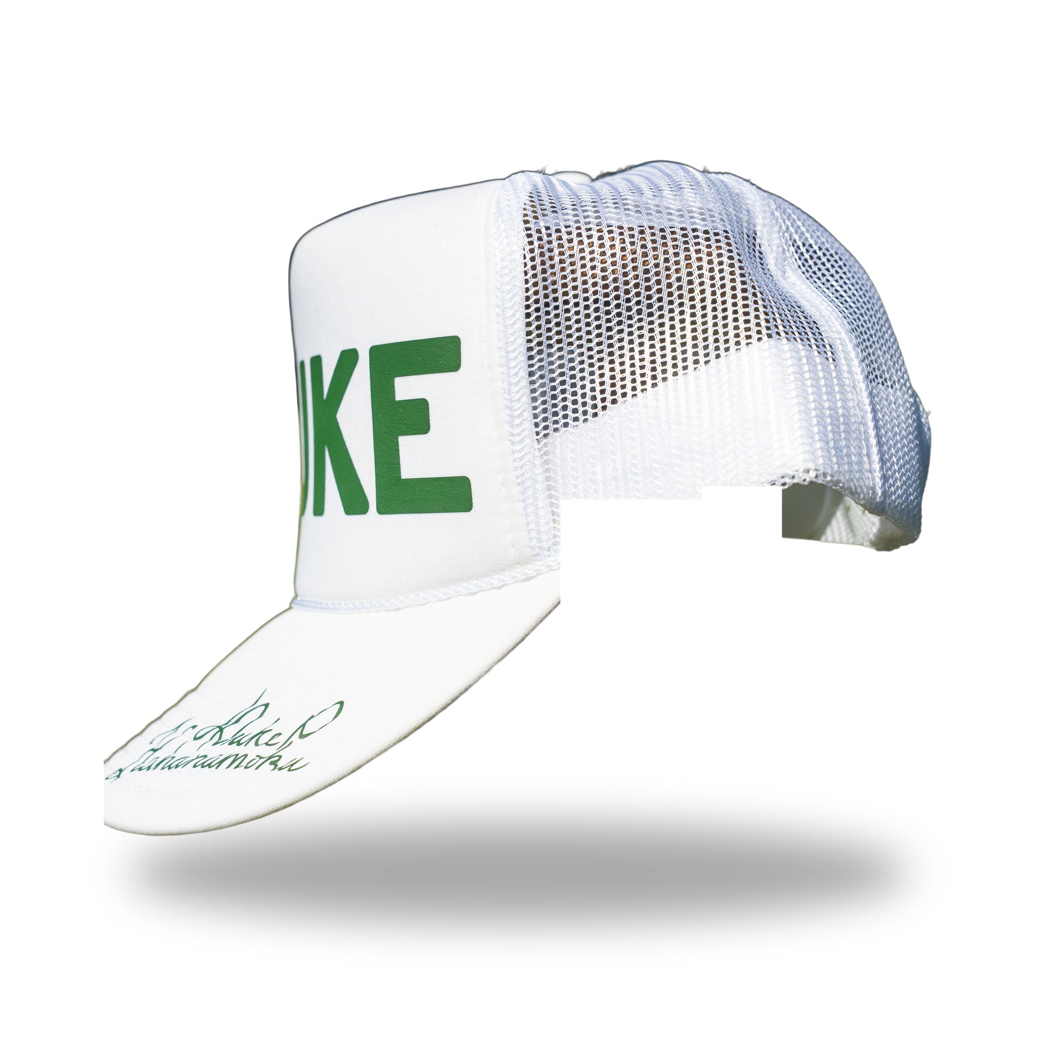 Angled rear view of white DUKE trucker hat with signature visible on the curved brim
