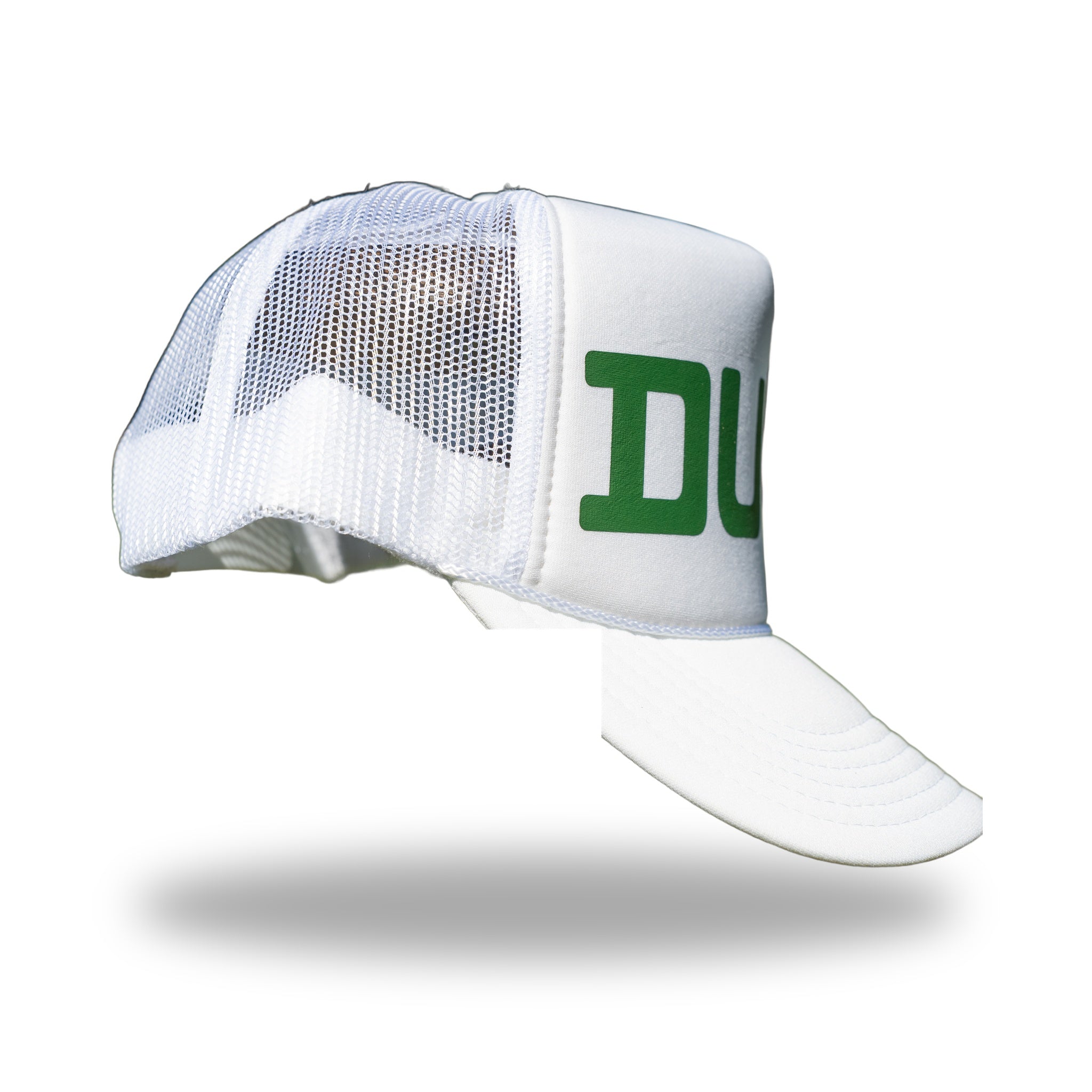 Side profile of white DUKE trucker hat showing breathable white mesh back panels